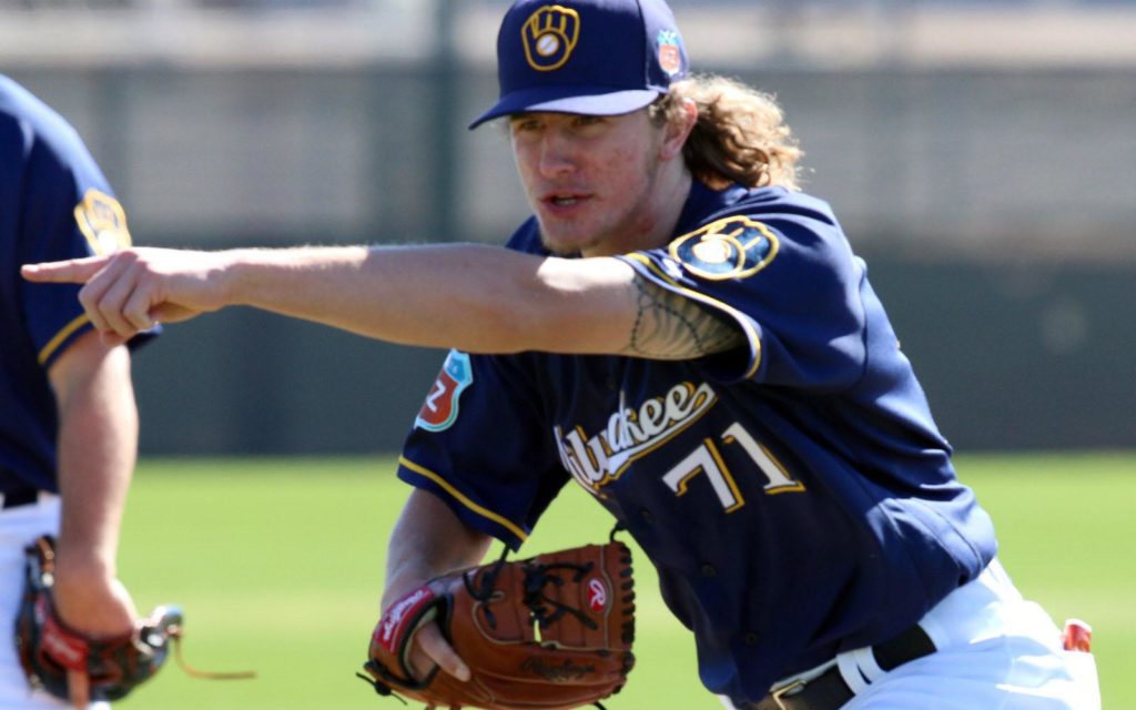 Milwaukee Brewers non-roster invitee Josh Hader, points to help his catcher field a wild pitch, Wednesday, February 24, 2016, in Phoenix. Arizona.(Photo/Roy Dabner) ORG XMIT: RD037